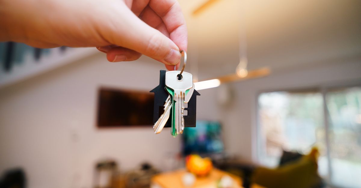 locksmith hands door — Broadway Locksmith and Automotive Corp