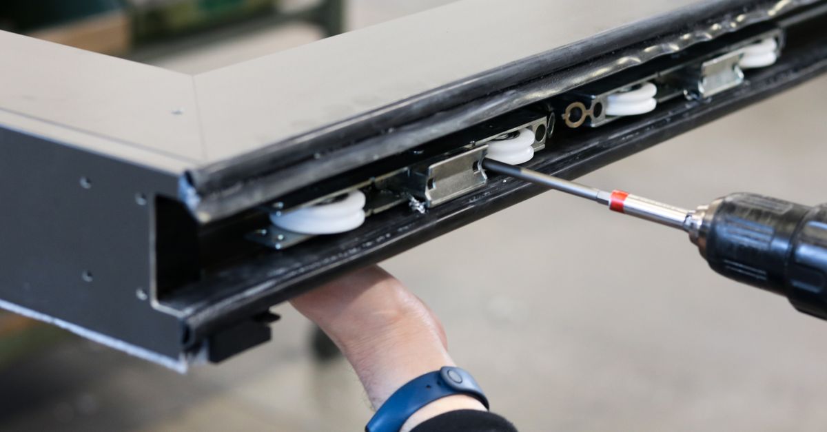 locksmith hands door — Broadway Locksmith and Automotive Corp